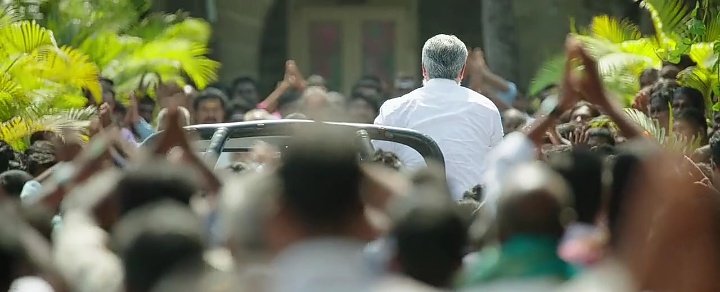 After the focus on left wheel, the back of the man with much respect is shown.. 