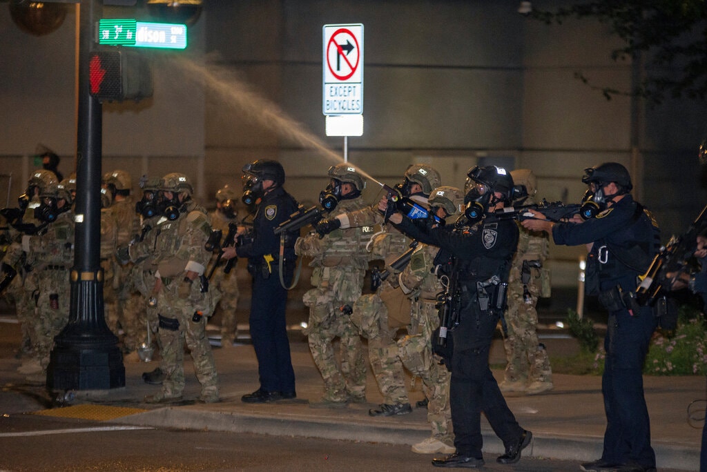 DHS FPS (Federal Protective Service) in  #PortlandRiots, using a SABRE Red MK-46 (OC burst up to 30 feet) and FN-303, and ICE SRT with HK69A1 with rails for sights