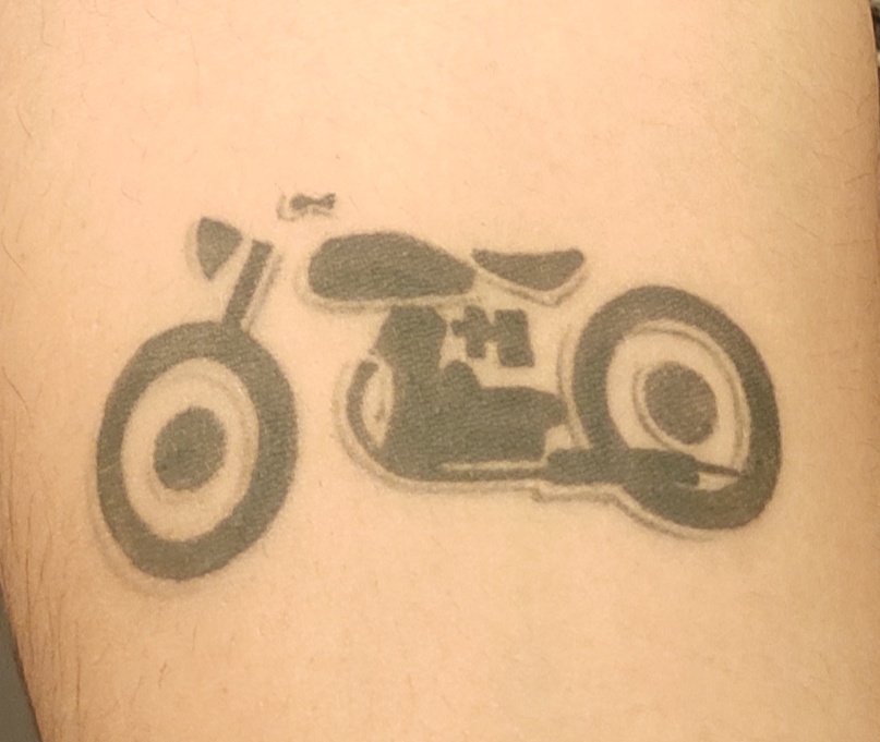 Black And Red Motorcycle Tattoo on Forearm