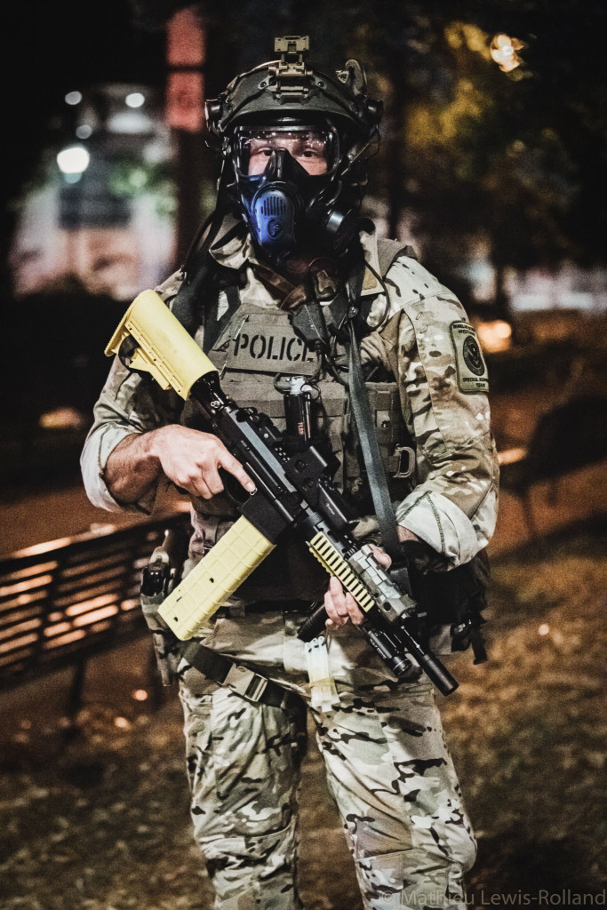 DHS Special Response Team in  #PortlandRiots, using a PepperBall VKS. Notice the BE-Meyers MAWL laser, EOTech sight and extended magazine.