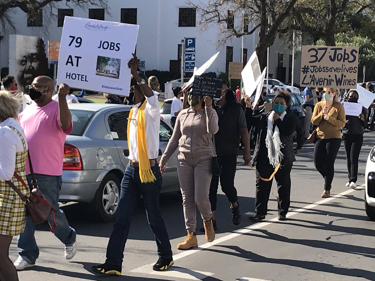 Locals in #Stellenbosch join restaurant and winery workers to show their support for #JobsSaveLives today. #visitStellenbosch #cycleStellenbosch