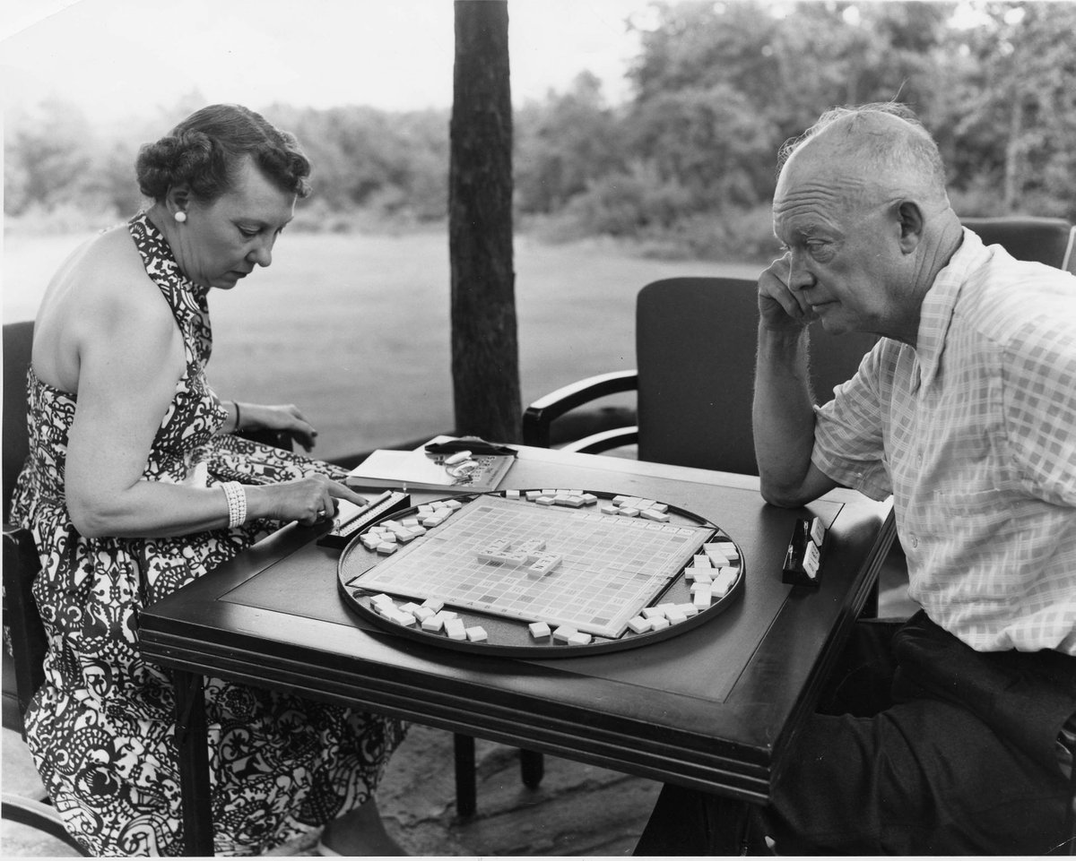 IkeLibrary's tweet photo. How would you caption this photo of Ike and Mamie playing a game of Scrabble? 
This pic was taken during a weekend vacation at Camp David, Maryland. (July 30, 1954) 
[📸67-82-A-17]
#IkeLife #DocumentoftheWeek #WeLoveMamie https://t.co/nhas0GeDEf