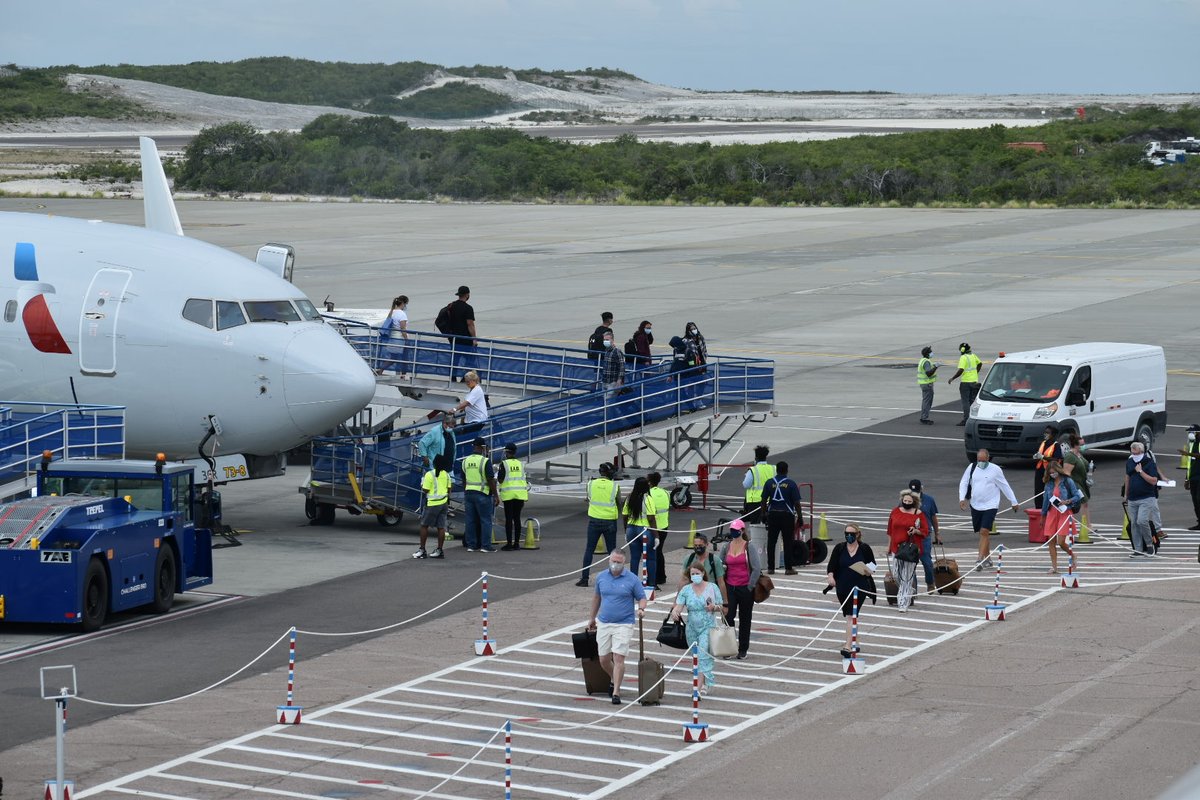 The arrival of the inaugural flight in the Turks and Caicos Islands at Providenciales International Airport since TCI's borders re-opened. 72 passengers disembarked American Airlines from Miami International.