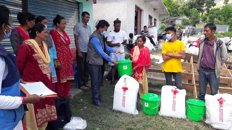 NepalRedCross's tweet photo. NRCS in #Bajura provided support  to 14 families today, whose houses were swept away due to #landslide  Among them, 8 families were given total package of #RedCross Non Food Relief Item. Additional 6 families were given #tarpaulin for temporary shelter. https://t.co/i6kIYEHoIh https://t.co/DJTogDO6b5