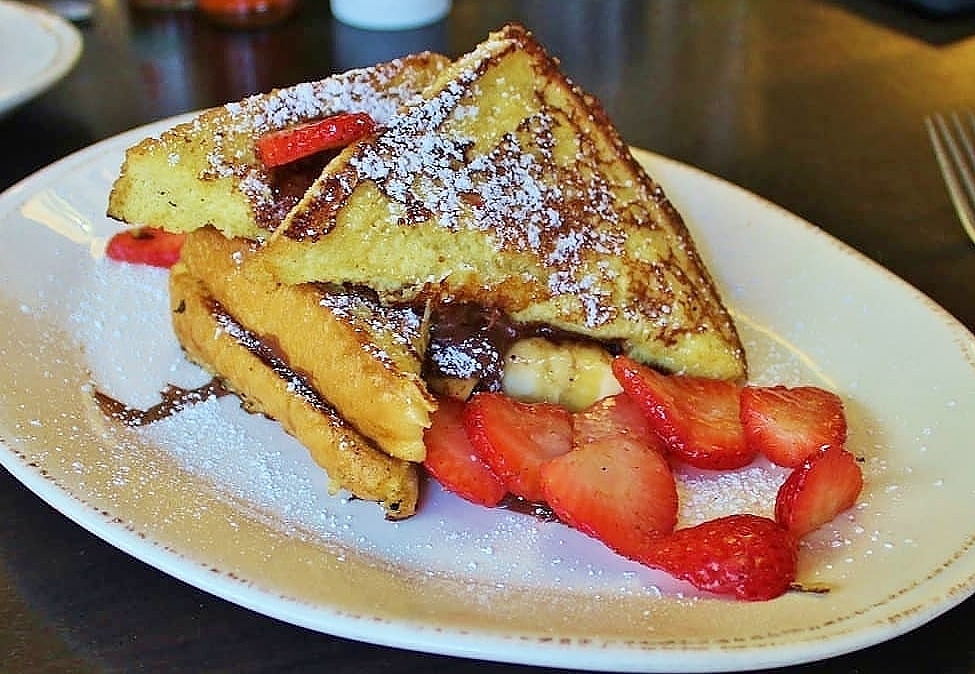 Syruprestaurant's tweet photo. Our Nutella Stuffed French Toast is a Syrup fan favorite! Creamy Nutella with Bananas &amp; fresh Strawberries, so delicious!

https://t.co/5tk2ryaBwJ 
#syruprestaurant #denver #brunch https://t.co/EhCdsrsRxh