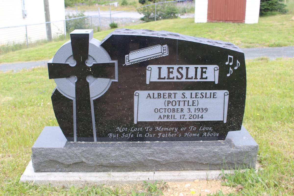 Here's an example of a granite headstone. More modern stones tend to be granite. Check out the sweet harmonica on this one!