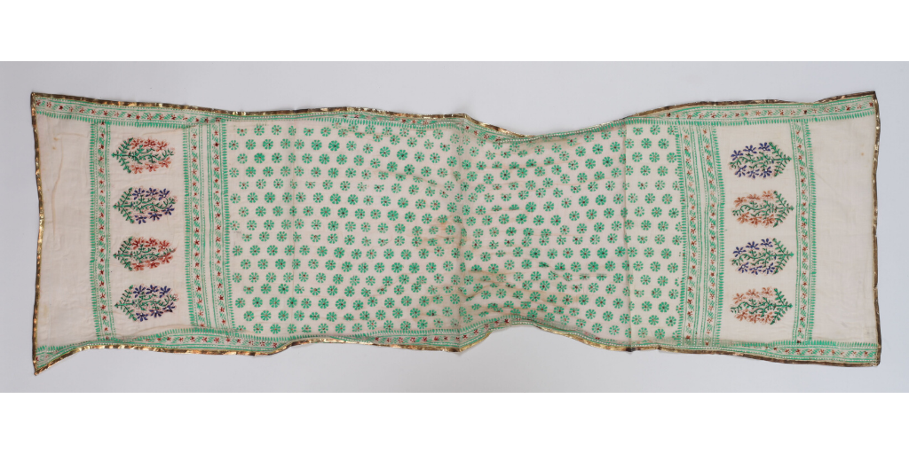 Our first object is this shawl, c.1878, made of muslin stencilled with flowers and edged with gold thread ribbon.  #SouthAsianHeritageMonth