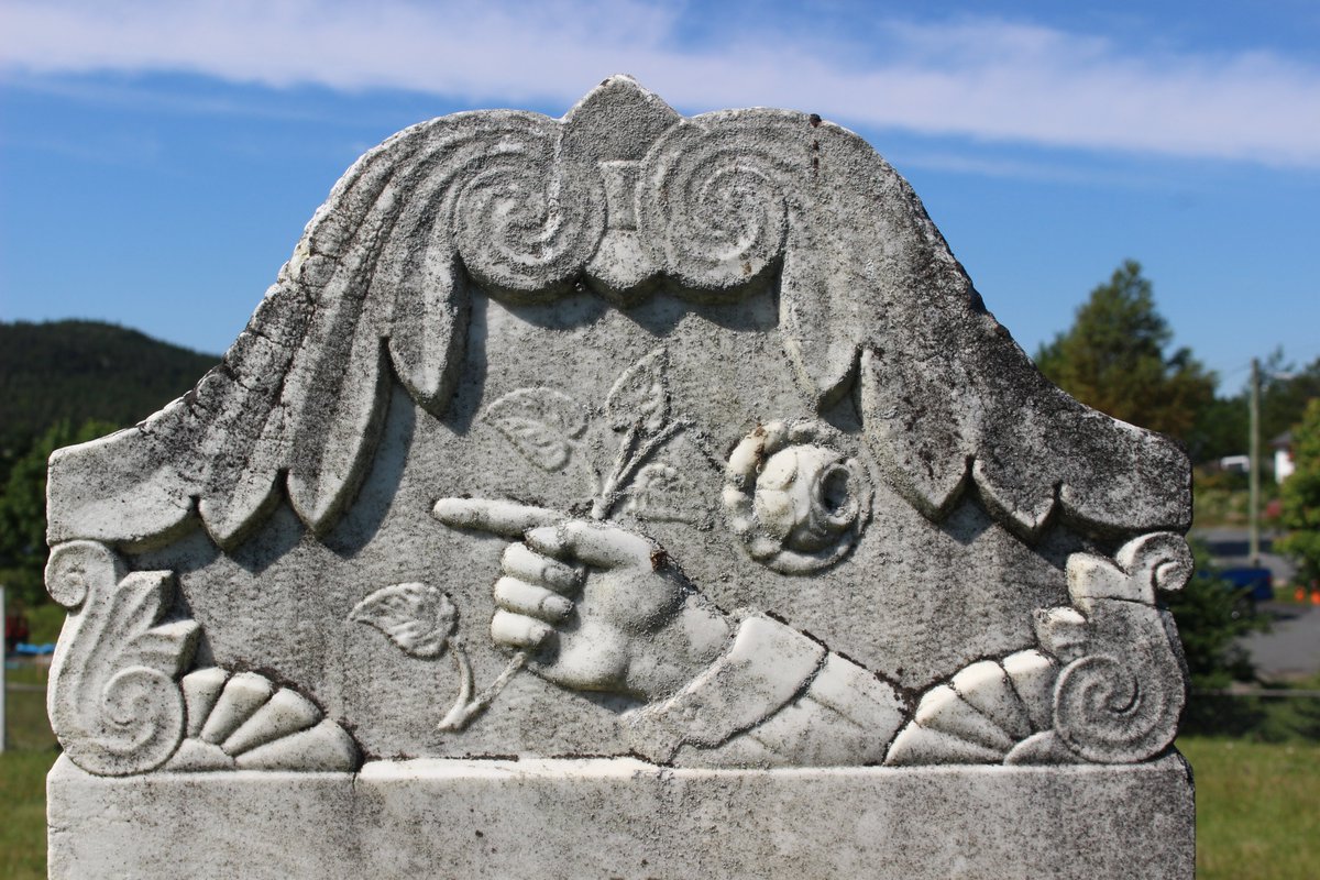 The rose on this stone indicates that the person died in the full bloom of life. Sometimes the rose is a bud, indicating the person died before they had a chance to bloom. Sometimes it's partially open.