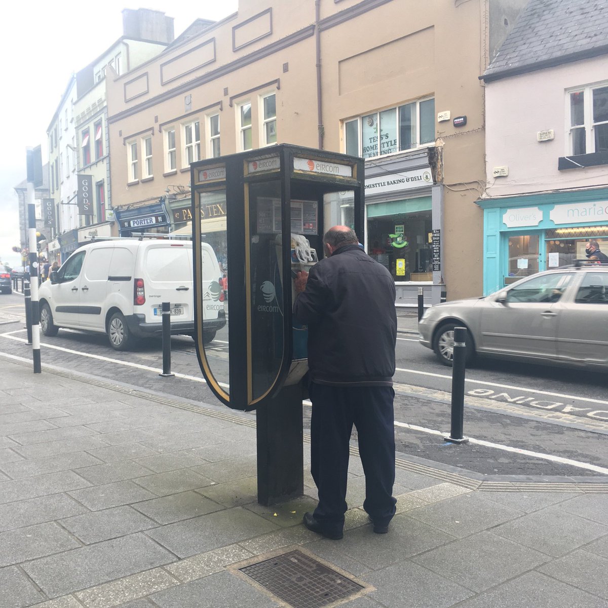July 2020. Man uses phonebox. Beautiful