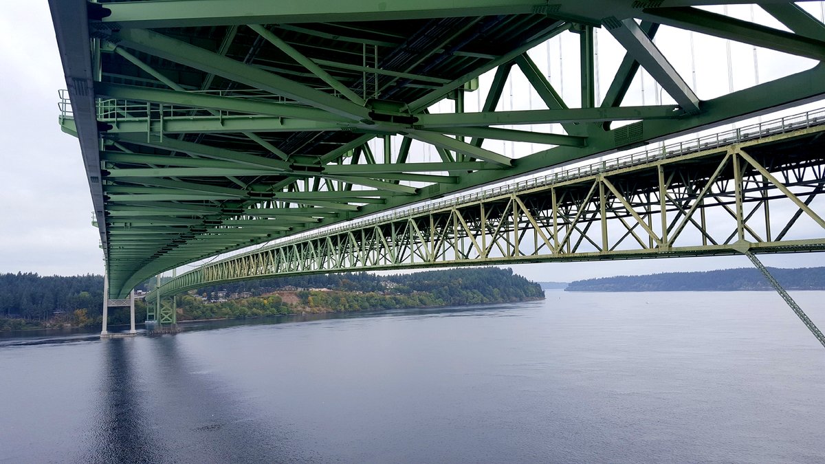LegacyTowers's tweet photo. Is this the underside of the Tacoma-Narrows Bridge? Yes! And there's a trolley that runs underneath that will carry Kenneth and crew over to the elevator that will take them up to the top for some microwave maintenance. We go anywhere! #LegacyTowers #RFSolutions #WirelessWizards https://t.co/Oi5XtQga69