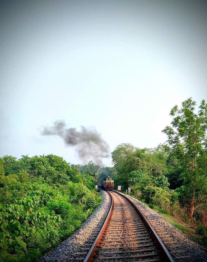 An Express train traversing the beautiful landscape in Shoranur- Nilambur section of ' God's own Country', Kerala