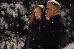 Shortly after Steed and Mrs Peel arrive on Serpentine Island (in their inflatable balls!) Sir August emerges from the shadows, grabs Emma, and threatens to kill her. But ends up releasing her. This explains her inexplicable unease before she and Steed crowd into the phonebox.