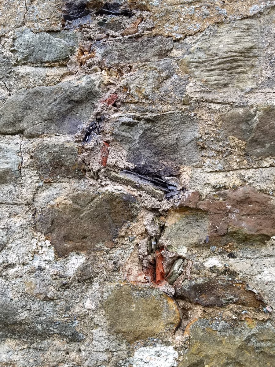 TimMeek8's tweet photo. Functional cherry cocking; hairy mortar. Left bits of tile, stone and where the joint gets narrow, jamming in slate. Hairy mortar folds around the cherry. Top right; jamming cracks. Btm right; ruled flush finish. Still damp. Needs redder sand. Get the idea? https://t.co/CzTQ03sZ06