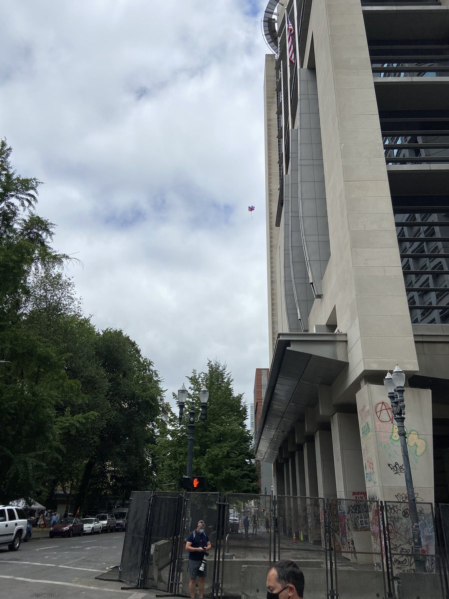 Last night’s balloons were just cut loose, as they install fences and concrete blocks #fedsgohome #blm