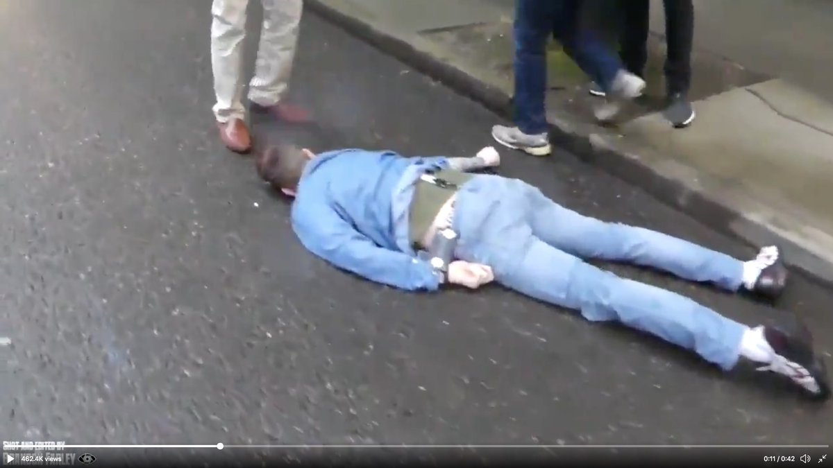 Cream-cop steps back as his partner--also in plainclothes--goes after suck-puncher.See the wide stride of the guy in jeans?It's called the "range walk."You cover ground REALLY fast without running.