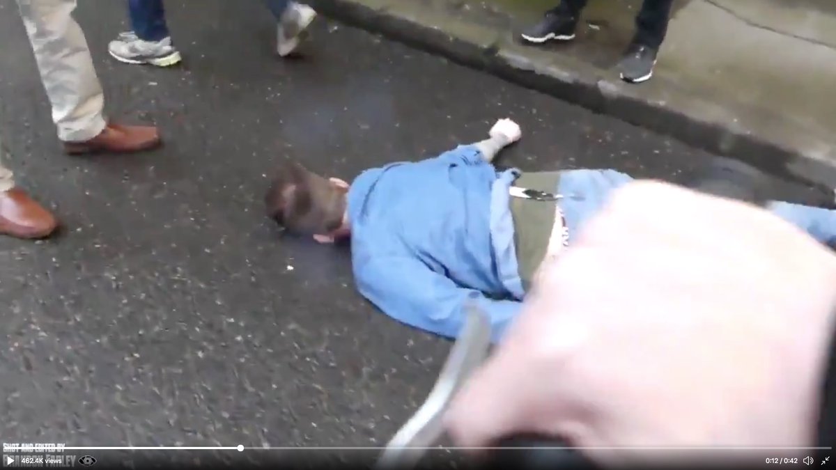 Cream-cop steps back as his partner--also in plainclothes--goes after suck-puncher.See the wide stride of the guy in jeans?It's called the "range walk."You cover ground REALLY fast without running.