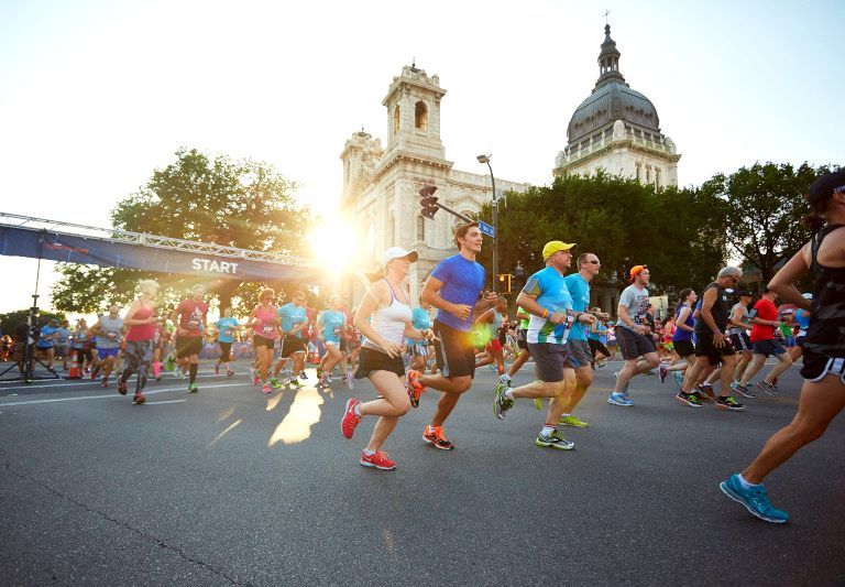 Torchlight5k's tweet photo. From the fiery start line through notable spots of downtown including the @Aquatennial parade route &amp; across the finish line to the post-race party, we're celebrating the memorable experience the live event has been over the years. What's your favorite part of the #Torchlight5K? https://t.co/vEaoFkTZF0