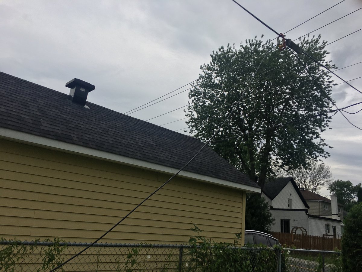 Jimcaveman's tweet photo. Could you please explain to me why your technicians left these wires dangling in my backyard with out notice and never came back? ⁦@Bell_Support⁩  #Dorval #Montreal https://t.co/sGRJOEkBtH
