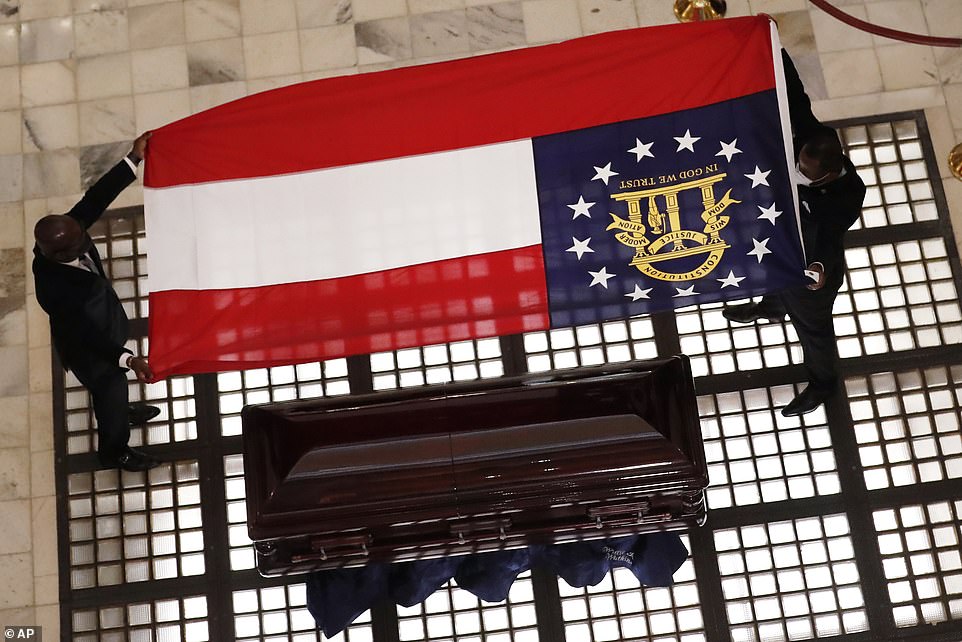 BlkGwinnett's tweet photo. How ironic? @GovKemp gave #RevCTVivian - the civil rights leader - family the original confederate flag - the #GaStateFlag - that they then draped over his casket. The things we do out of pure ignorance. #WhoIsTheJokeOn #WhatRacismLooksLike https://t.co/uZTcm8TSAi