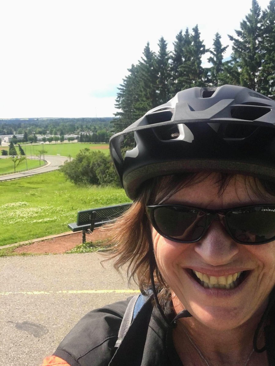 TourismRedDeer's tweet photo. This is the face of a very happy team member. Thank you @mudsweatngears for helping us put this smile on Colleen's face at the top of the Michener Hill. #RedDeerStrong #VisitRedDeer https://t.co/4XAB123jf4