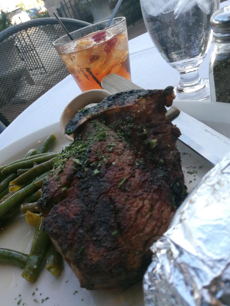 Bone in Filet, seared rare, and an old fashioned, outside on the patio. #DinnerTime #CHICAGOLAND
