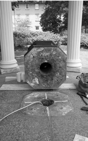 Fast forward. In 2001, plumbers were repairing the Old Well, the fountain was removed, exposing the original well shaft. They noted that the stones lining the well were identical to stones used in walls that we know were built on campus by enslaved people around the same time.