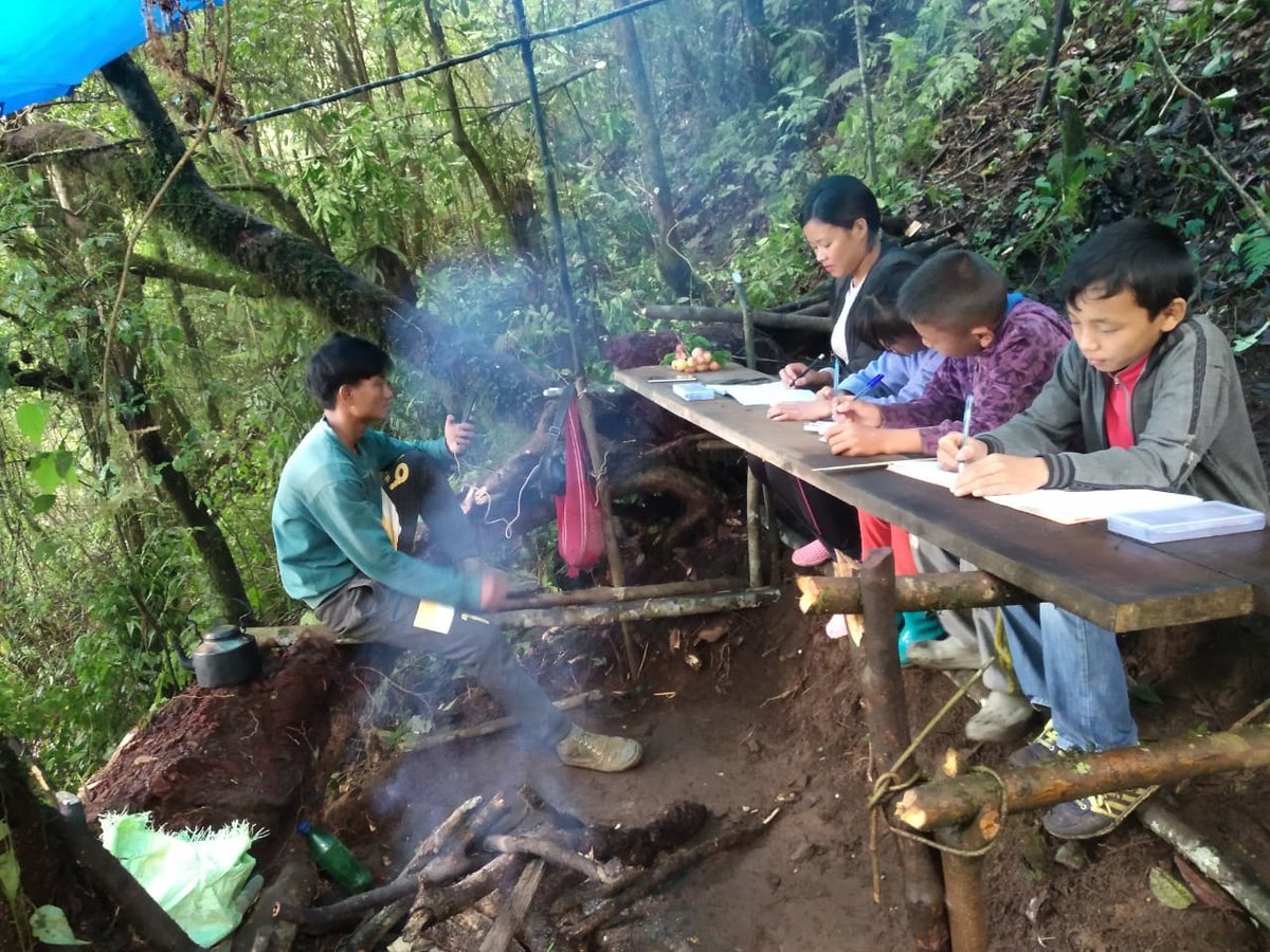 EastMojo's tweet photo. Students of Thsuruhu village in Nagaland's Zuneheboto district taking an online exam at a make-shift jungle camp due to lack of proper Internet connection. Thsuruhu Students' Union is taking initiative by setting up camps and providing security in the dense forests of Nagaland. https://t.co/FMyUVweOxG