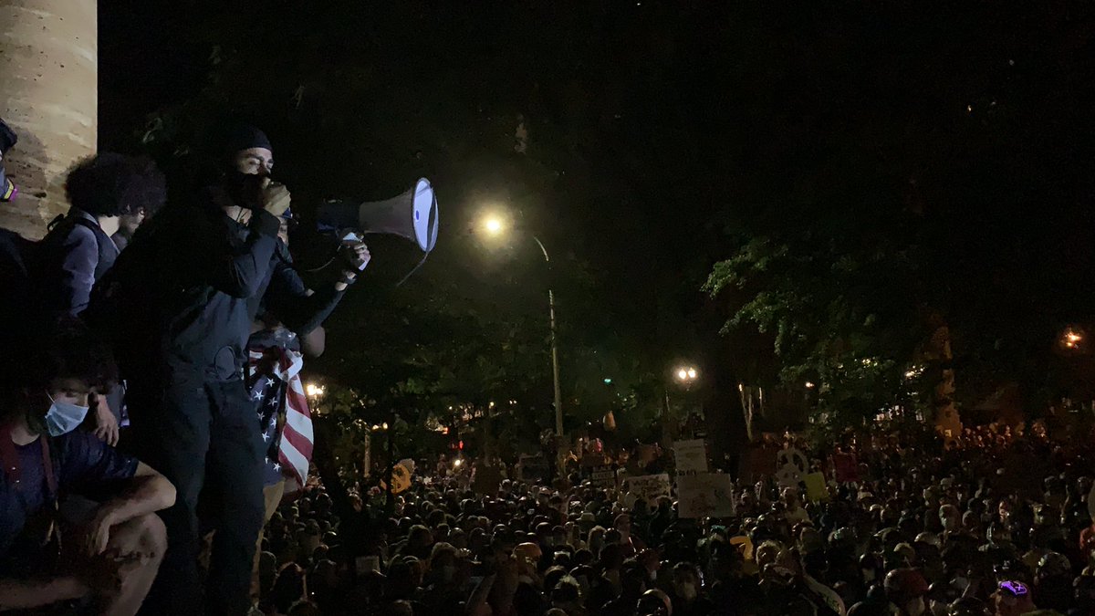 New person on the mic. “Ted Wheeler just came up here and talked a bunch of bullshit!” they say. “We want him to resign, period. We do not want police reform. History has shown us that reform does not work. We want complete abolition, period.”