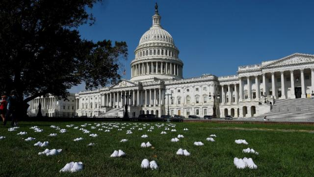 thehill's tweet photo. Nurses place shoes on Capitol lawn for every colleague who died of coronavirus https://t.co/f1dN2sB683 https://t.co/7Uz1Zb6OY1