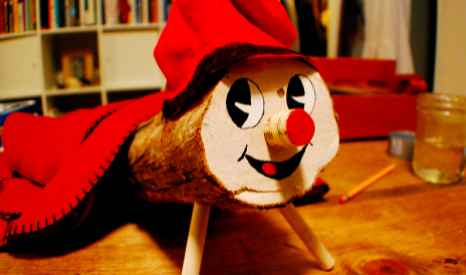 It was not a translation error. It turns out that in Barcelona, Caga Tió is a 'Christmas log' with a smiling face & red hat. The log is placed in the living room on the 8th of December and has to be fed daily with traditional Christmas food like turró (Spanish nougat).