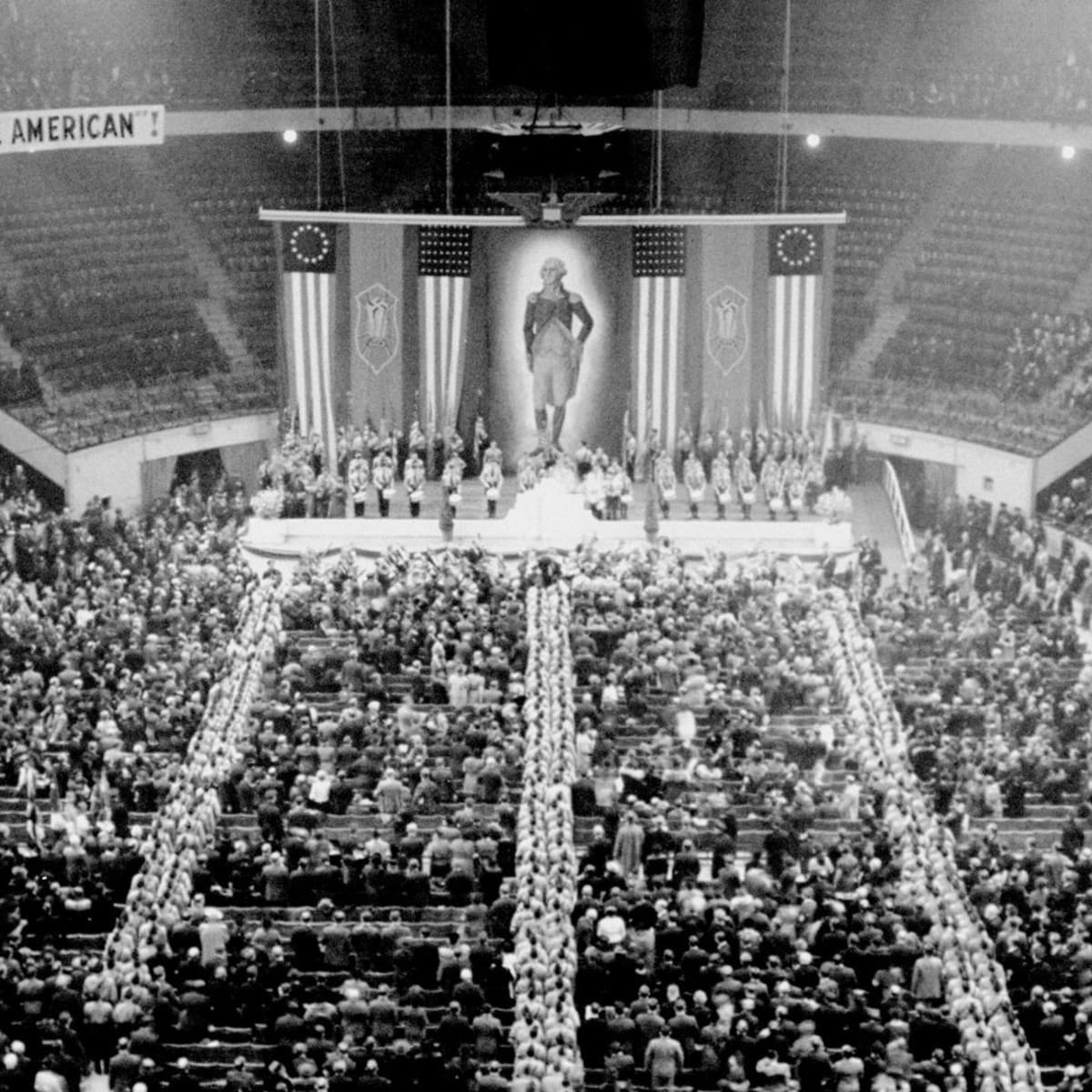 In 1939, a peculiar crowd of 10.000 gathered in Madison Square Garden. The meeting called itself "pro American", but the banners draping the stage sent a different message. Let's zoom in.  #history  #ww2