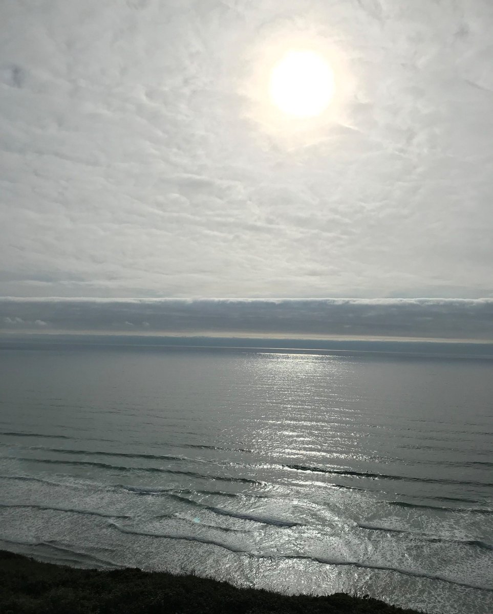 WatergateBay's tweet photo. Heat hazed early evening sun. Taken from the cliff path above the north end of the beach. 

Thank you @ElaineUff for sharing the image with us. Perfect for @tatestives #ColoursofCornwall Greys week: 'Hazy Bay Grey'

#watergatebay #watergatebayhotel #lovecornwall https://t.co/vycaGLXPON