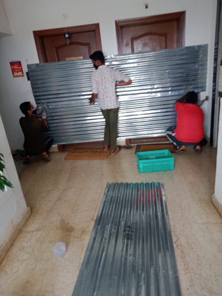 satishs's tweet photo. BBMP sealing done in our building for a confirmed Covid case.  Lady with 2 small children, next door neighbours are an aged couple. What if there is a fire, @BBMPCOMM ? Understand the need for containment, but this is an extremely dangerous fire hazard - please address urgently. https://t.co/pCDMn5Pefl