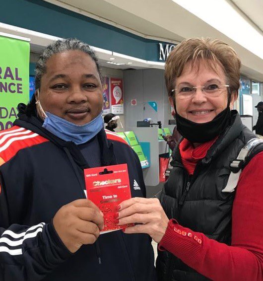 Paarl Rotary is supporting a number of feeding schemes during the pandemic. Here Rotarian Hester Visagie (right) presents a Checkers food voucher to the value of R5000 to Vanessa Adams of Fountain of Hope. #charity #paarl