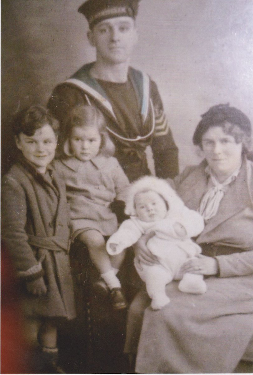 This is the only photo that she has with her Mum and Dad, brother, sister from childhood. She's the baby (1937). Her Dad became a merchant marine when he went to England from Ireland. Later he joined the navy and later was on the Queen Mary. Her Mum was a pianist in a pub.3/
