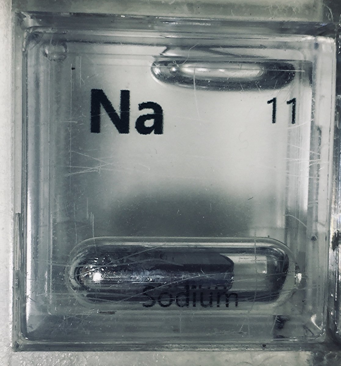 Sodium  #elementphotos. Sodium is reactive so it needs to be stored in an argon-filled ampoule (Pic 1), or (less ideal but more practical for use) under oil. Last Pic has an ampoule surrounded by rock salt crystals (NaCl).