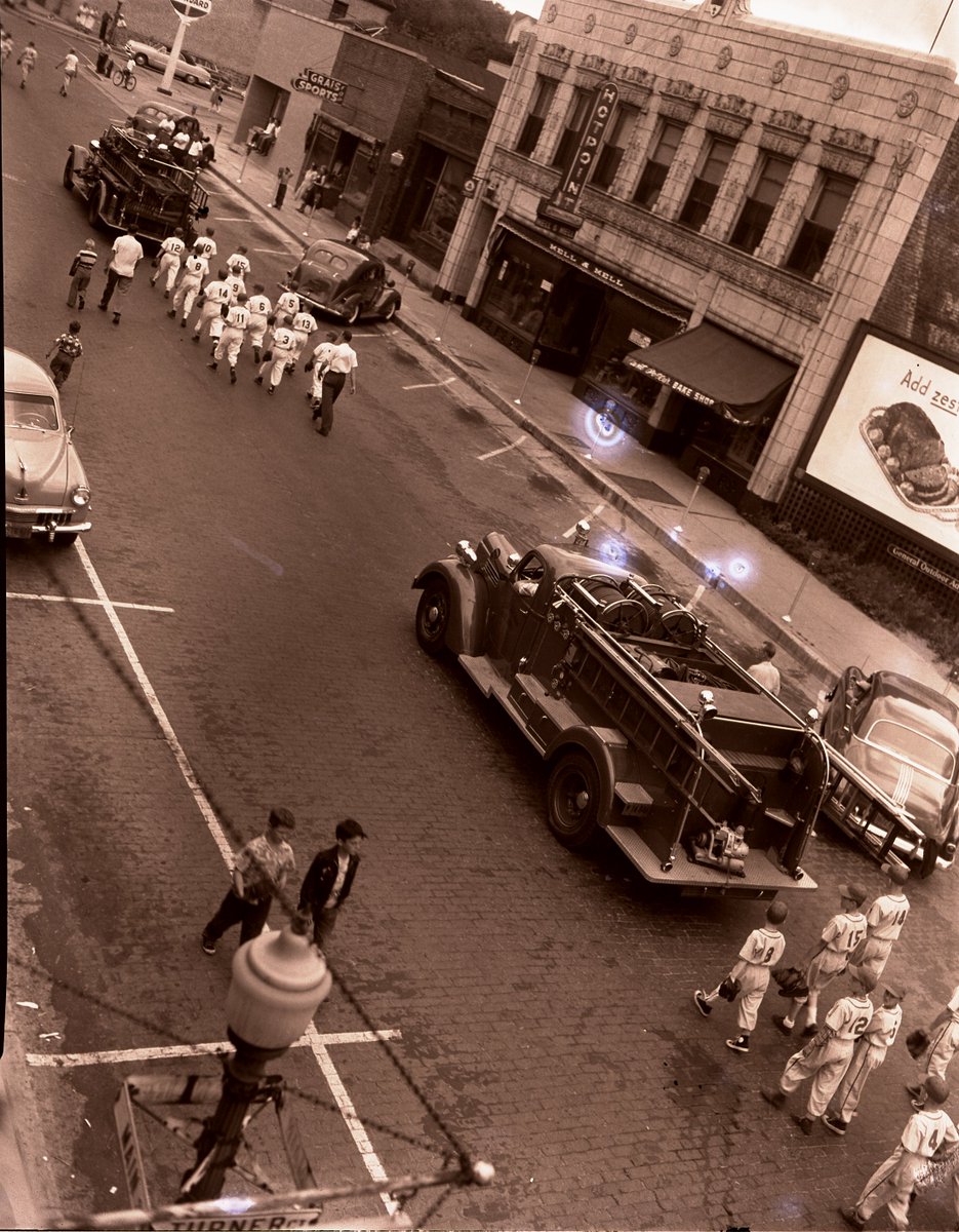 WeGoHistory's tweet image. If there are two things we have sure missed this year it is the Railroad Days Parade and summer baseball! With the MLB opening day today, we are featuring this image of our local baseball teams marching in a parade down Main Street! #ThrowbackThursday  #MLBOpeningDay