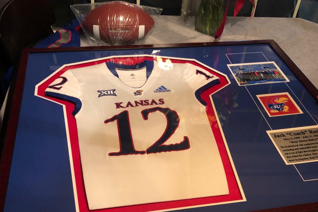 Matt_Fortuna's tweet photo. Who was Jack Roche? A guy just as likely to make a burner account to motivate his team as he was to dance after a win. A guy unafraid to tell a lineman off and talented enough to play the fiddle on St. Paddy's.

On the legacy of Kansas' 21-year-old manager https://t.co/Reoqmt3TSi https://t.co/6aWCHL29dd