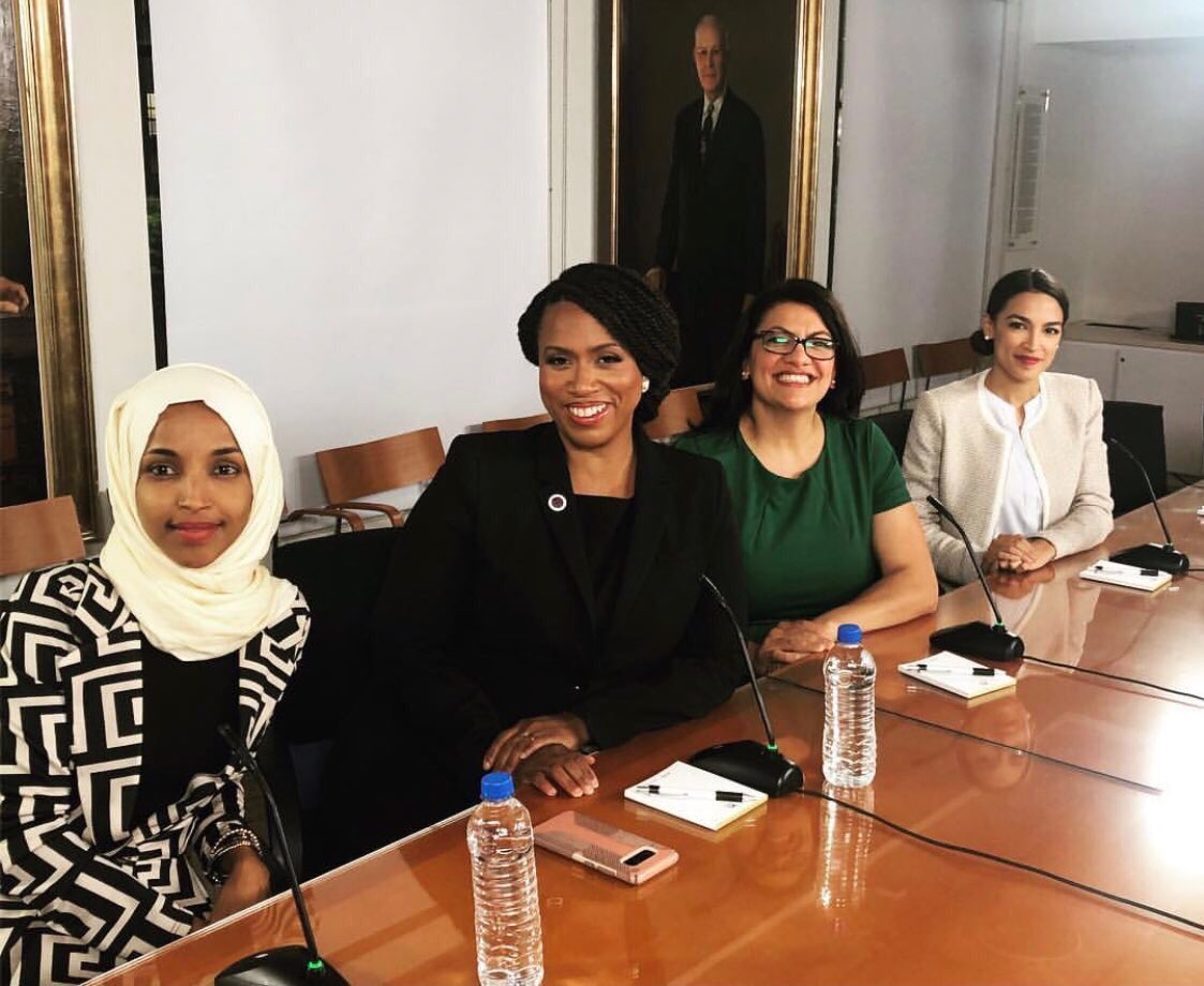 See that picture hanging on the wall behind Reps. Ilhan Omar, Ayanna Pressley, Rashida Tlaib, and Alexandria Ocasio-Cortez?The US Congress is full of statues & pictures white men. Omar & Tlaib: 1st Muslim womenPressley: 1st Black woman from MAOcasio-Cortez: youngest woman