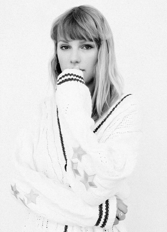 this is me pretending to be a model as i show off my brand new merch