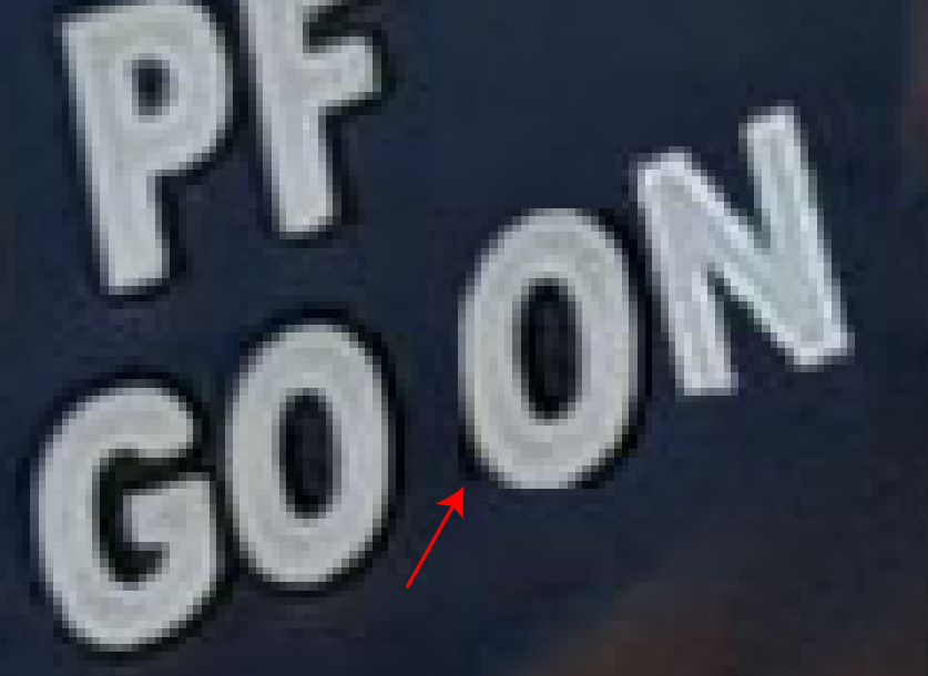 Close up, the additional "ON" looks far less authentic than the other letters on the masks. We can see that the "O" for "ON" was borrowed from the "O" right next to it. It only has shadow on the right side of the letter and in a small corner of the bottom left.