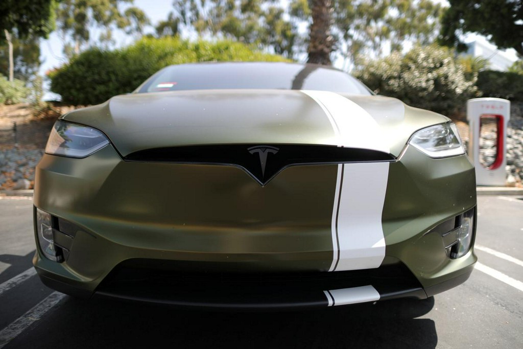 Reuters's tweet photo. 'Please mine more nickel,' Musk urges as Tesla boosts production https://t.co/XmnR9ilMEr https://t.co/wAvnXCcRf4