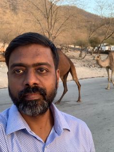 AndeiSoI's tweet photo. #Throwbackpic In Oman at anti-gravity pint.. #marvelsofNature . Enjoying the scene with a few CAMELS!!!! I think they want to be in the selfie with me 😜 https://t.co/qXO1dr3nqx