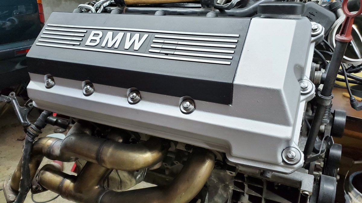 Painted the valve covers and spun the bolts/washers for an improved overall look in the engine bay