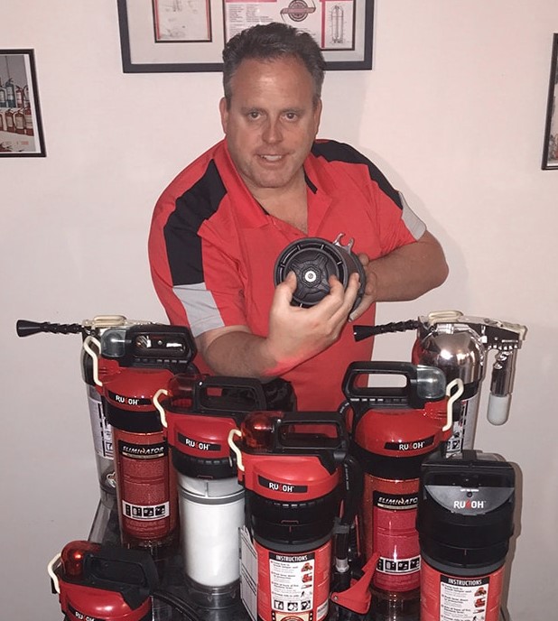 Rusoh_Inc's tweet photo. #TBT... Creator of the revolutionary Rusoh Eliminator fire extinguisher, Randy Rousseau, showing off the fluffing wheel while standing with some of the earlier, test &amp; prototype Eliminator designs.

#Rusoh #Eliminator #FireExtinguisher #FluffingWheel #Innovation #FireProtection https://t.co/f8JVtmfa33