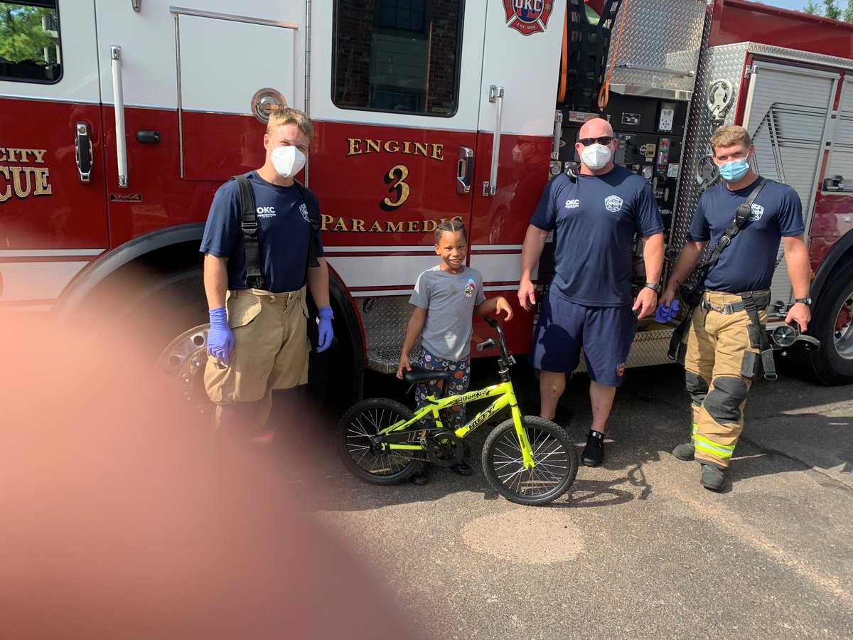 OKCFD's tweet photo. The crew from Engine 3 ran on a medical call today. While there, they noticed a bicycle in the corner of the house. The child said it was broken and no one could fix it. Operation "Fix The Bike" began. The firefighters had the happy kiddo rolling again in no time. #Community https://t.co/VNwG9kne0R