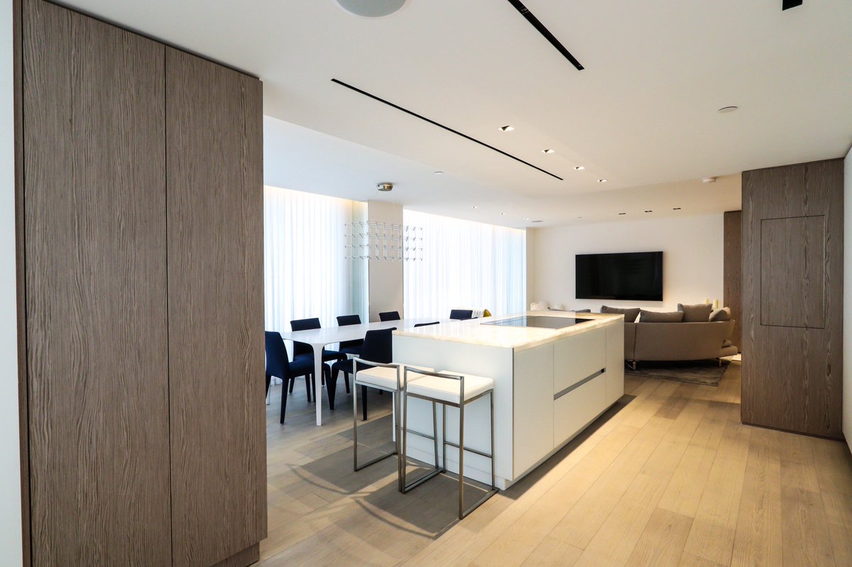 DavilaWoodwork's tweet photo. Right by the water, this Miami Beach apartment features Plank Silver Gray Oak paneling and White Satin finished cabinetry. Beautifully designed by designer Carol Deane 
from Interior Lab Studio! https://t.co/RLDj4mFxrx