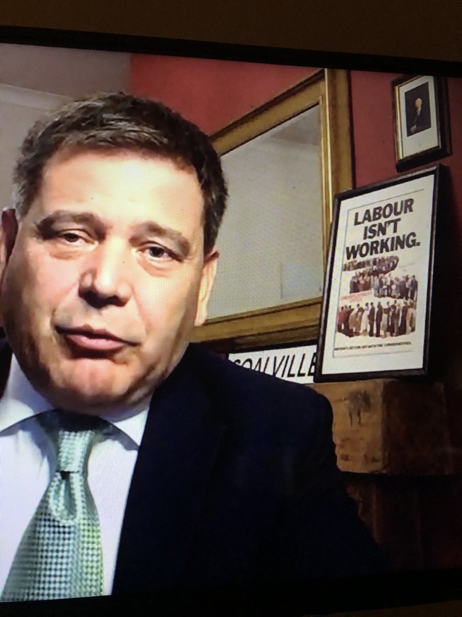 Why does Newsnight accept this tosser putting this up in the background talking about Covid19 ?