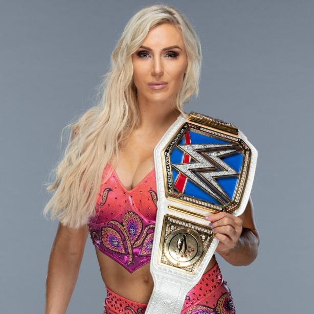 haven_higgins's tweet photo. I'm currently bidding on this very belt in this photo signed by Charlotte Flair. The bid also includes a signed Charlotte action figure and poster. https://t.co/Jz8AVH9y4E
