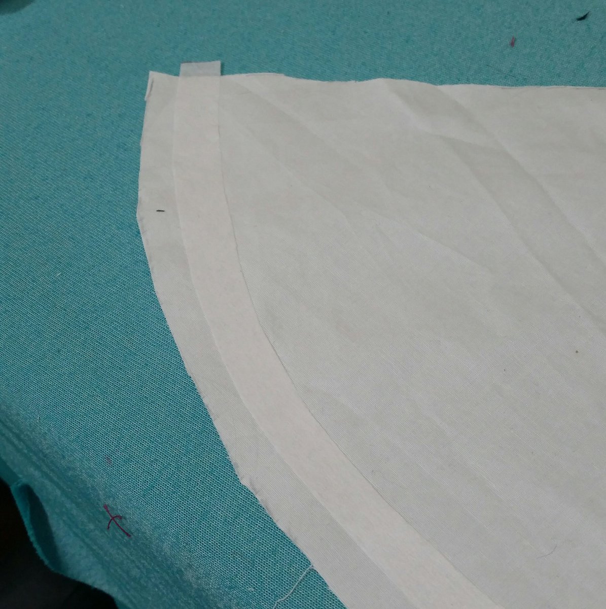 Ok so second test, with a poplin--I wanted to keep that cartoony line but not totally stiff, so I cut an arc of interfacing that got attached right along the hem then heat shaped into wavy ruffles. It needs fussing but I think the effect is good